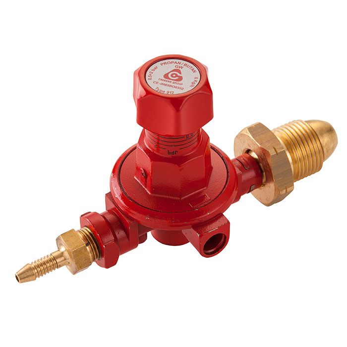 Red gas regulator with brass fittings on a white background