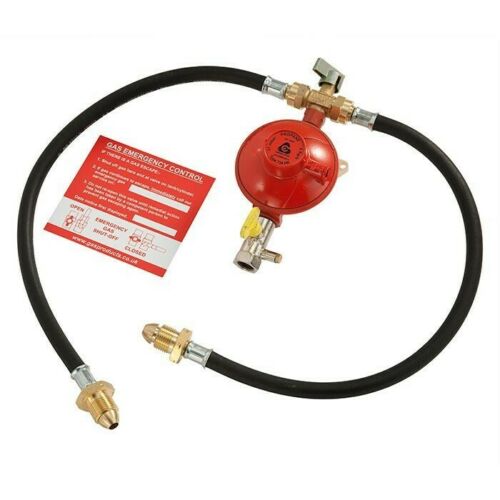 Red gas regulator manual changeover with black hoses and emergency control label on a white background